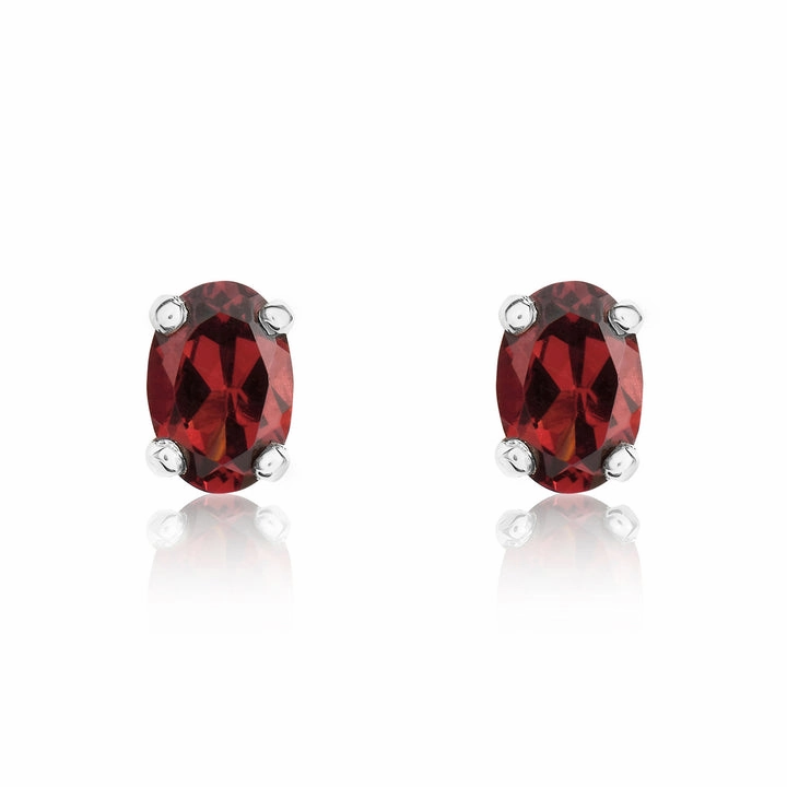 9ct white gold 6x4mm oval garnet claw set stud earrings